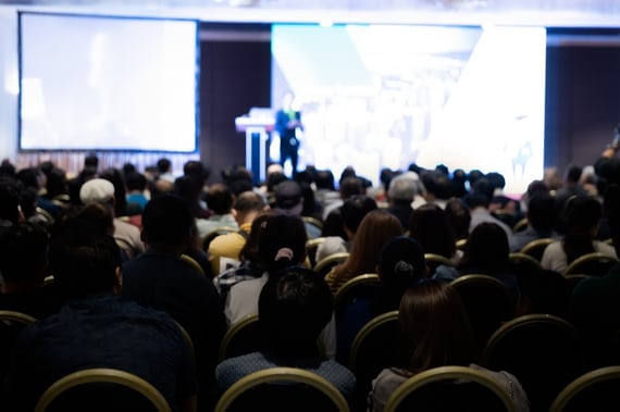 Back of conference hall during presentation.