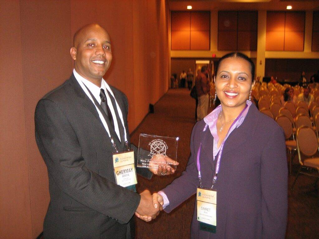 NLT CEO Ghermay Araya accepts New Business Partner of the Year award in 2006
